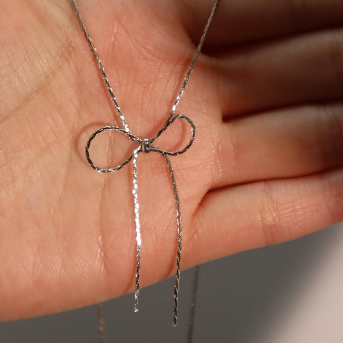 Titanium steel chain bow necklace