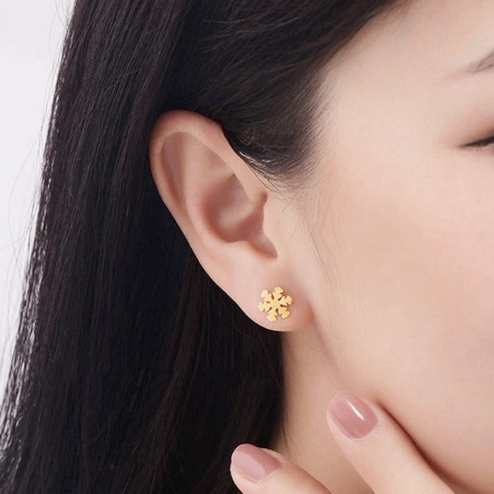 Two snowflake stud earrings