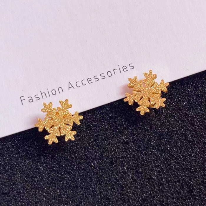 Two snowflake stud earrings