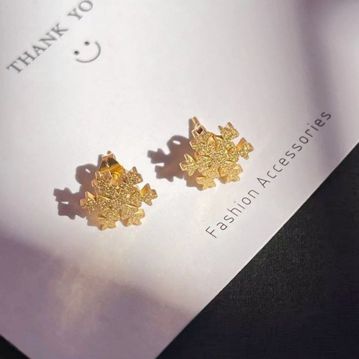 Two snowflake stud earrings